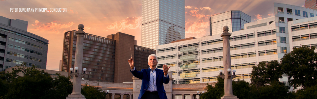 Principal conductor Peter Oundjian conducting in front of the Denver Civic Center
